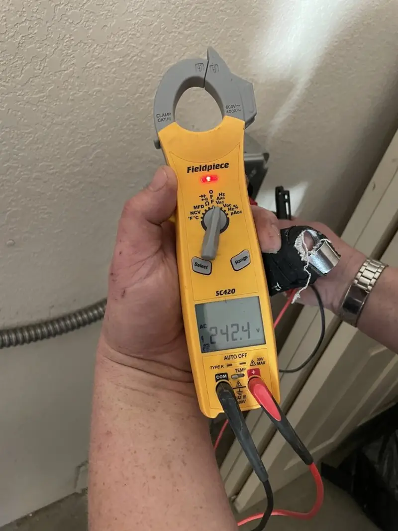 Voltage testing with clamp meter during Ceiling Fan Installation in Somerville